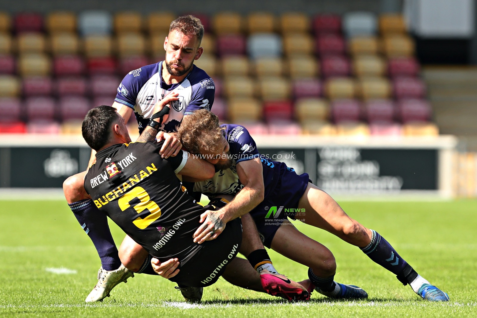 Ben Reynolds of Featherstone Rovers and Connor Jones of Featherstone Rovers tackle Kieran Buchanan of York Knights RLFC during the Betfred Championship match York City Knights vs Featherstone Rovers at LNER Community Stadium, York, United Kingdom, 29th June 2025(Photo by Sam Eaden/News Images)