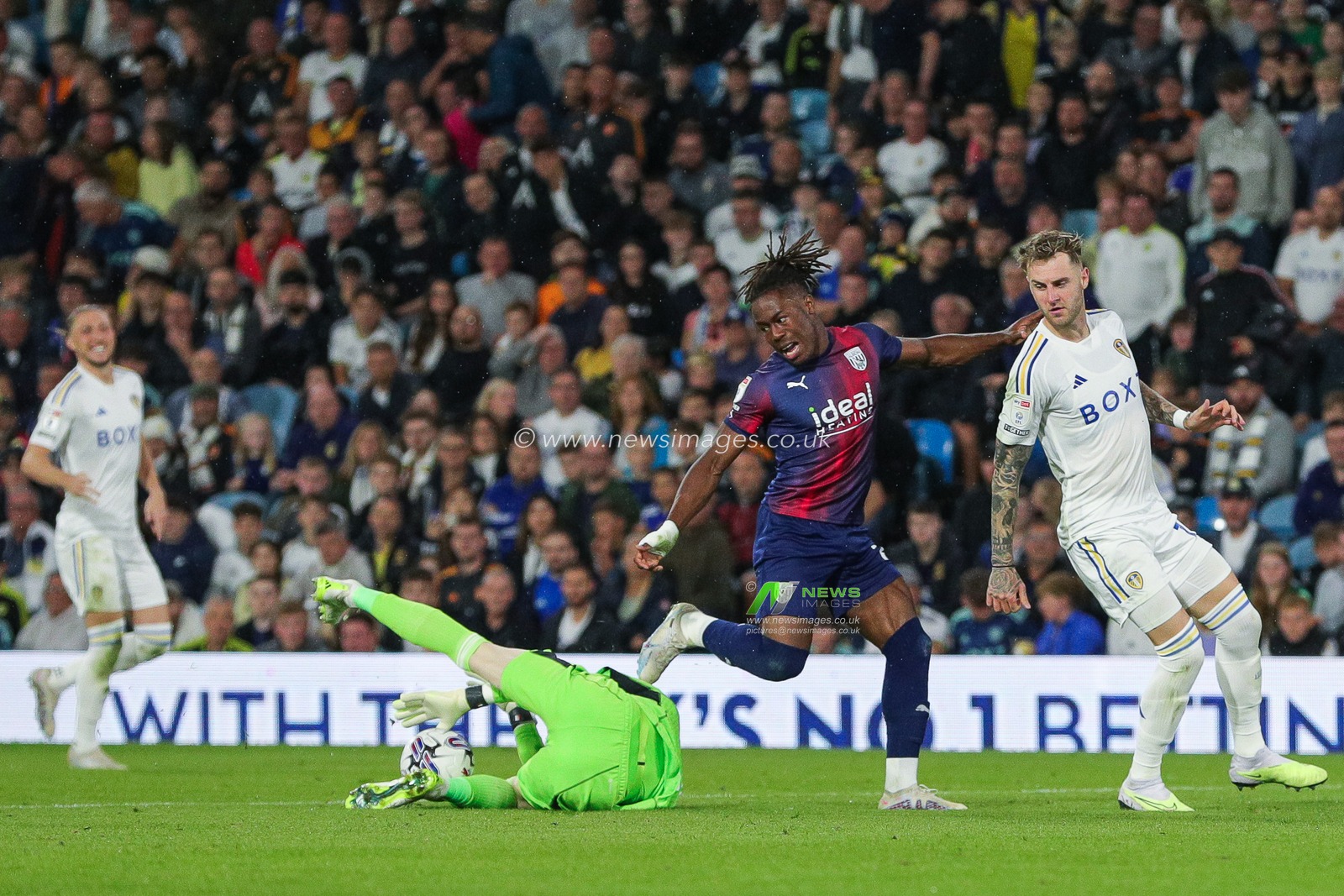 Illan Meslier #1 of Leeds United saves at the feet of Brandon Thomas-Asante #21 of West Bromwich Albion during the Sky Bet Championship match Leeds United vs West Bromwich Albion at Elland Road, Leeds, United Kingdom, 18th August 2023

(Photo by James Heaton/News Images)