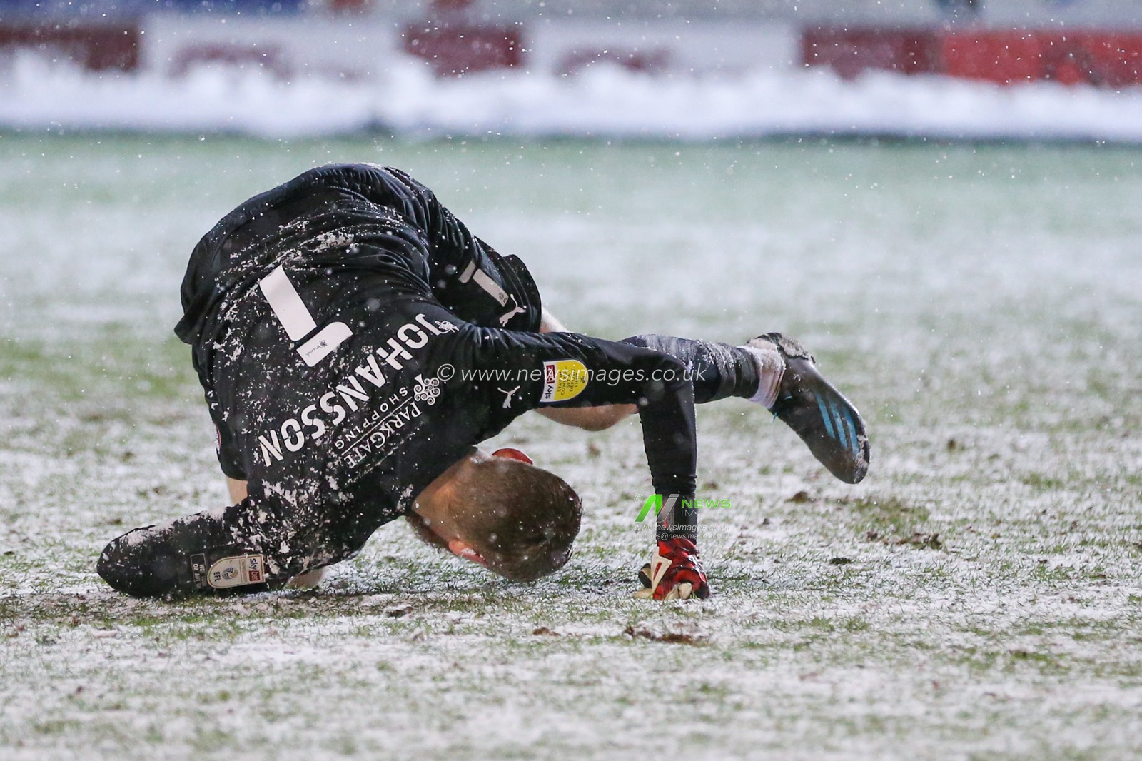Viktor Johansson #1 of Rotherham United falls over after taking a goal kick