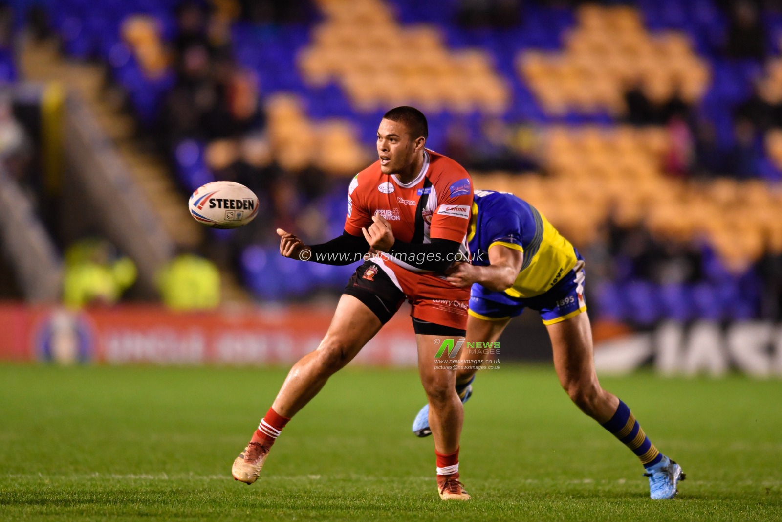 23rd January 2020, Halliwell Jones Stadium, Warrington, England; Rugby League Pre Season, Warrington Wolves v Salford Red Devils : Tui Lolohea (6) of Salford Red Devils passes the ball while being tackled