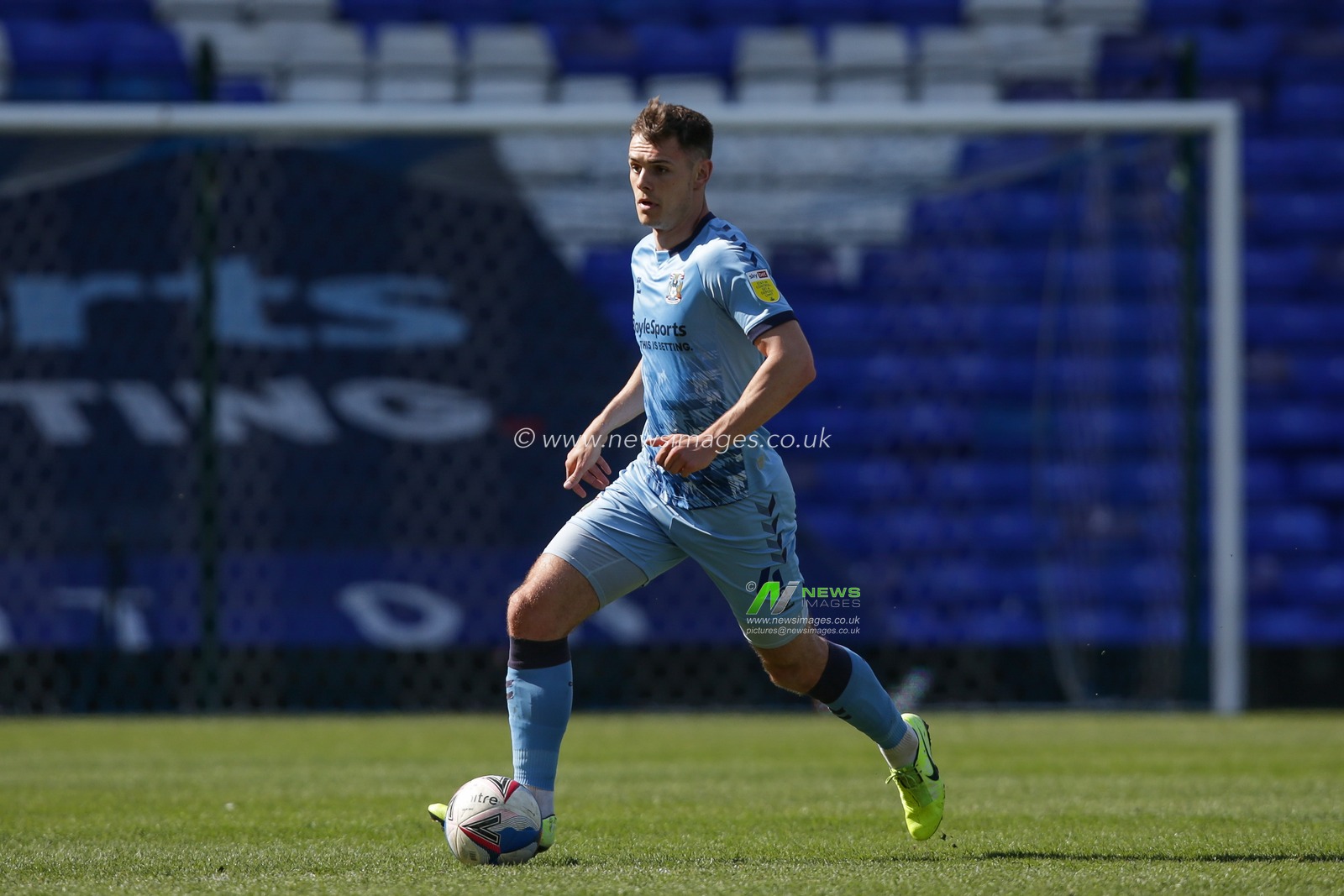 Michael Rose #4 of Coventry City dribbles the ball