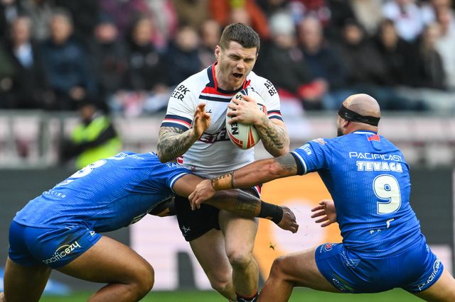 John Bateman of England is tackled by Francis Molo of Samoa and Jazz Tevaga of Samoa during the ABK Beer Internationals Series match England vs Samoa at The Brick Community Stadium, Wigan, United Kingdom, 27th October 2024

(Photo by Craig Thomas/News Images)