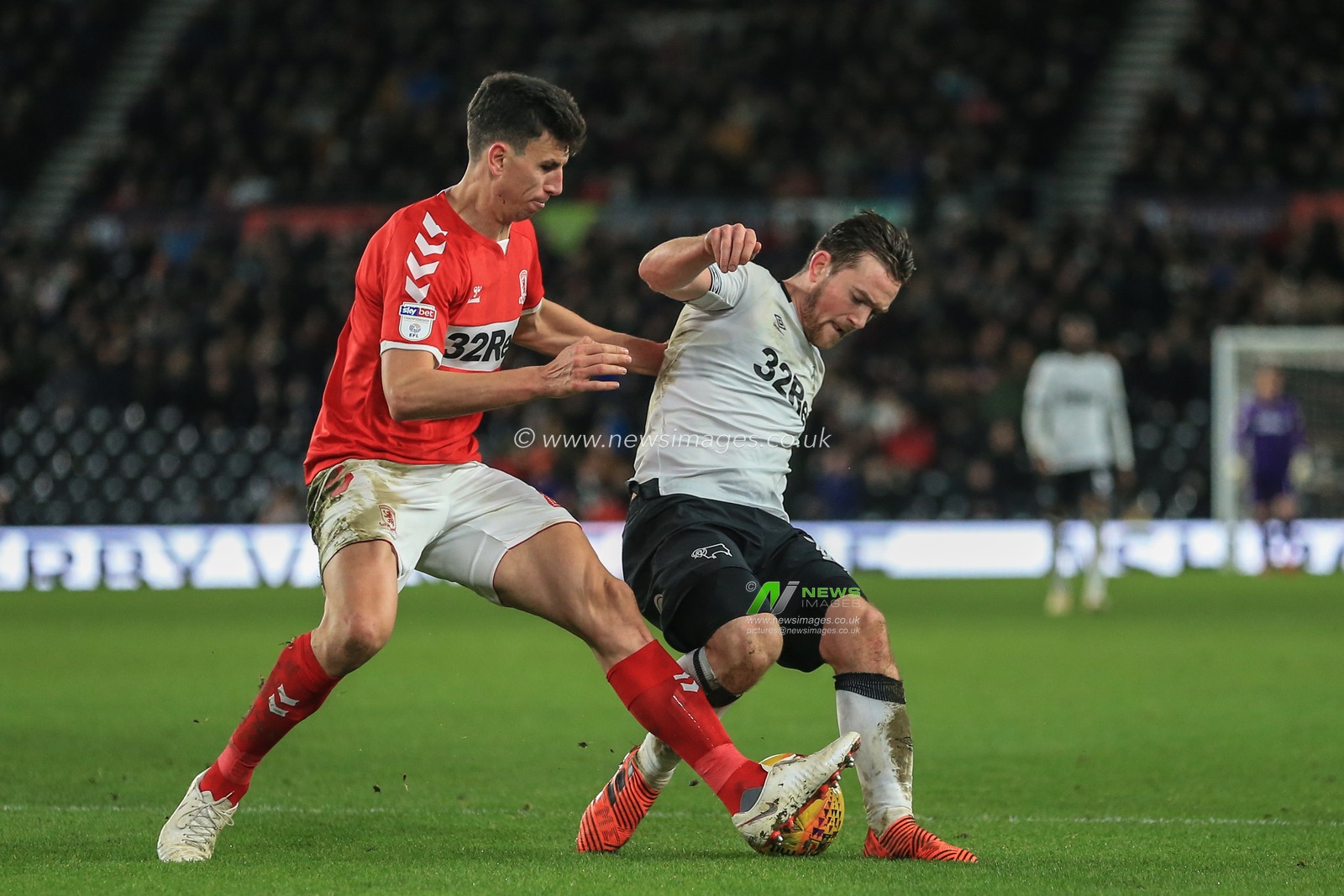 1st January 2019, Pride Park, Derby, England; Sky Bet Championship, Derby County vs Middlesbrough ; Daniel Ayala (04) of Middlesbrough tackles Jack Marriott (14) of Derby County 

Credit: Mark Cosgrove/News Images 

English Football League images are subject to DataCo Licence