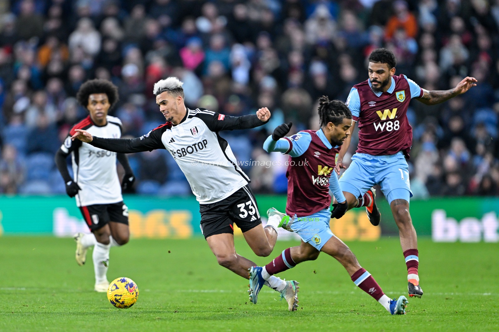 Lorenz Assignon of Burnley fouls Antonee Robinson of Fulham, during the Premier League match Burnley vs Fulham at Turf Moor, Burnley, United Kingdom, 3rd February 2024

(Photo by Cody Froggatt/News Images)