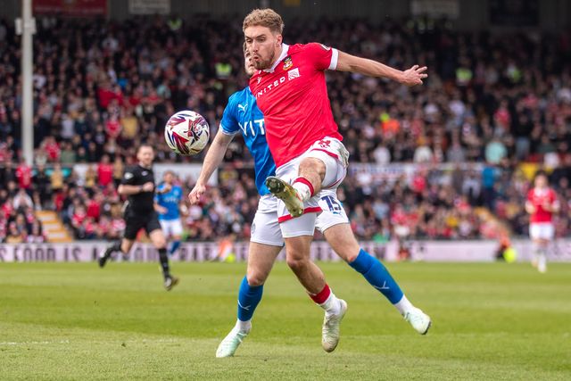 Wrexham's Sam Smith controls the ball during the Sky Bet League 1 match Wrexham vs Stockport County at SToK Cae Ras, Wrexham, United Kingdom, 22nd March 2025

(Photo by Nik Mesney/News Images)