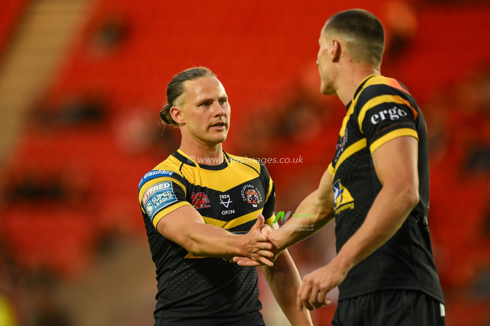 Innes Senior of Castleford Tigers celebrates his try with Jacob Miller of Castleford Tigers during the Betfred Super League Round 16 match St Helens vs Castleford Tigers at Totally Wicked Stadium, St Helens, United Kingdom, 5th July 2024

(Photo by Craig Thomas/News Images)