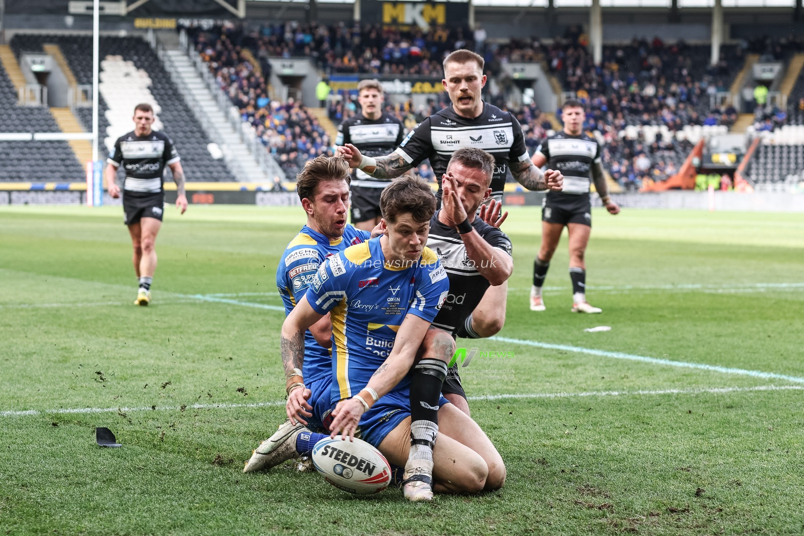 Riley Lumb of Leeds Rhinos goes over for his second  try to make it 6-10 during the Betfred Super League Round 9 match Hull FC vs Leeds Rhinos at MKM Stadium, Hull, United Kingdom, 28th April 2024

(Photo by Mark Cosgrove/News Images)