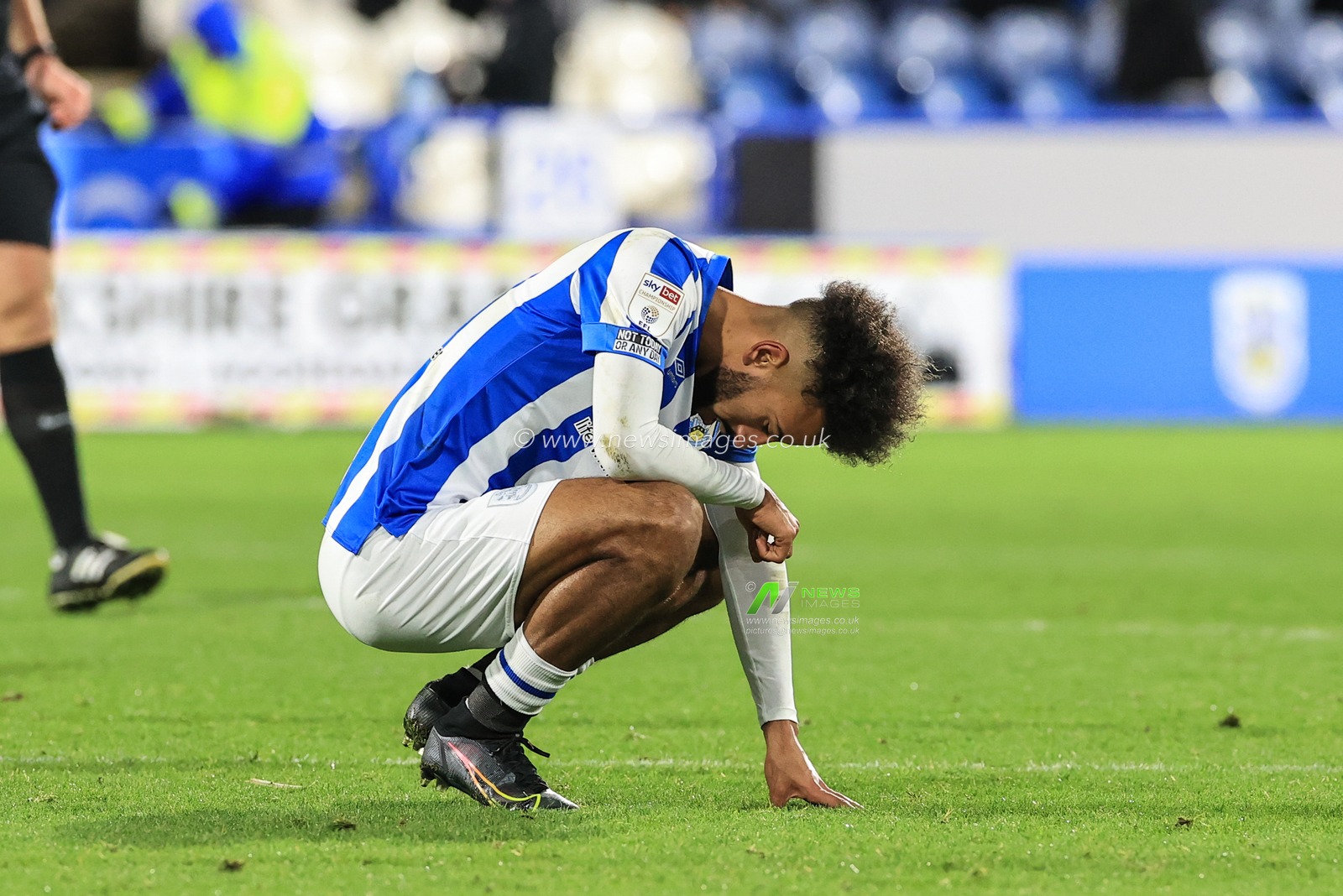 A dejected Sorba Thomas #16 of Huddersfield Town after they lose 1-2