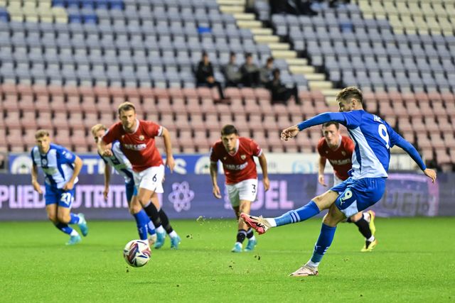 Joe Hugill of Wigan Athletic scores a goal to make it 1-1 during the Bristol Street Motors Trophy match Wigan Athletic vs Morecambe at DW Stadium, Wigan, United Kingdom, 3rd September 2024

(Photo by Cody Froggatt/News Images)