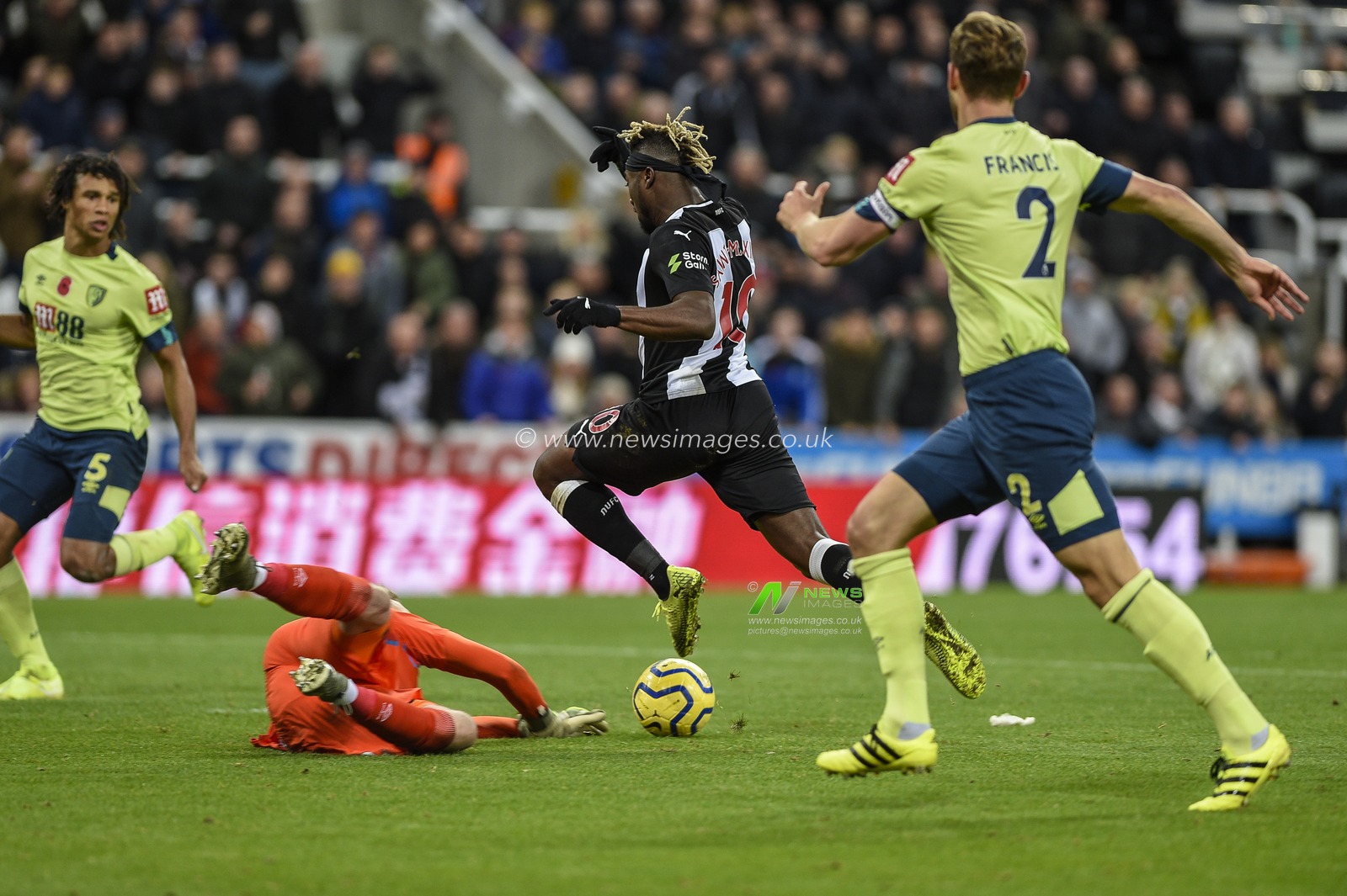 9th November 2019, St. James's Park, Newcastle, England; Premier League, Newcastle United v Bournemouth : Aaron Ramsdale (12) of Bournemouth dives at the feet of Allan Saint-Maximin (10) of Newcastle United

Credit: Iam Burn/News Images