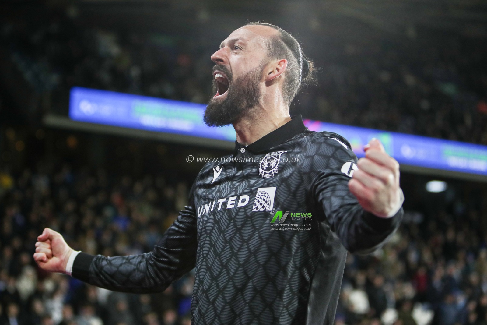Steven Fletcher of Wrexham celebrates after scoring to make it 1-0 during the Sky Bet League 1 match Huddersfield Town vs Wrexham at John Smith's Stadium, Huddersfield, United Kingdom, 4th March 2025

(Photo by Jorge Horsted/News Images)