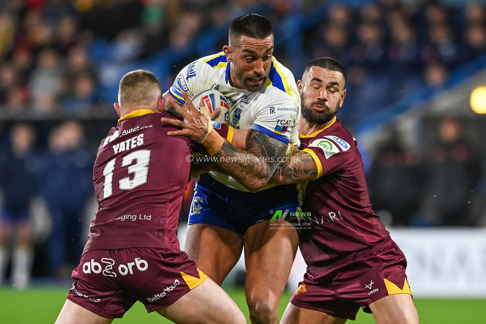 Paul Vaughan #10 of Warrington Wolves is tackled by Luke Yates #13 and Nathan Peats #9 of Huddersfield Giants during the Betfred Super League Round 2 match Huddersfield Giants vs Warrington Wolves at John Smith's Stadium, Huddersfield, United Kingdom, 24th February 2023

(Photo by Craig Thomas/News Images)