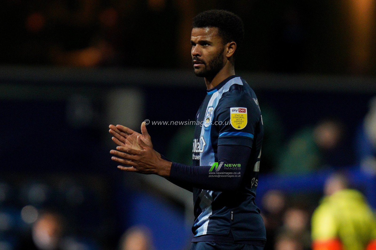Fraizer Campbell #22 of Huddersfield Town thanks the fans for their support