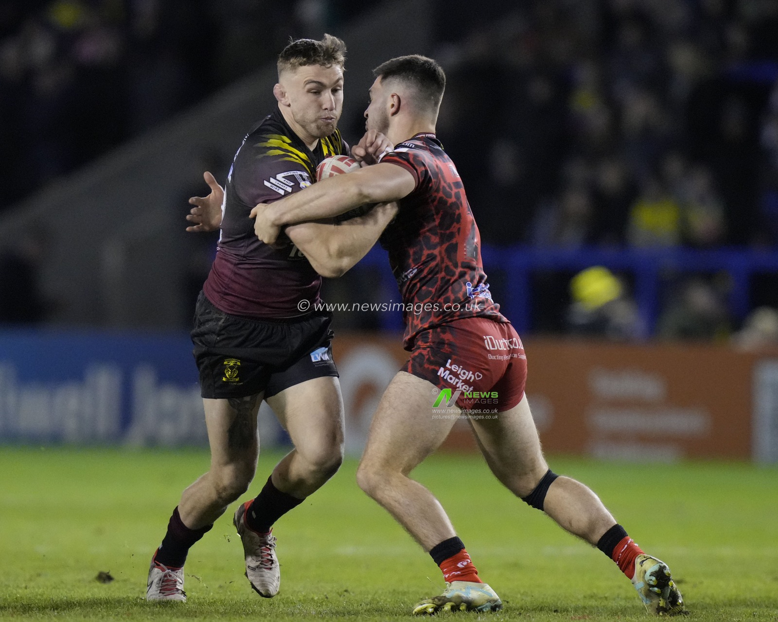 Sam Powell of Warrington Wolves runs at Lachlan Lam of Leigh Leopards during the Rugby League Joe Philbin Testimonial match Warrington Wolves vs Leigh Leopards at Halliwell Jones Stadium, Warrington, United Kingdom, 3rd February 2024

(Photo by Steve Flynn/News Images)