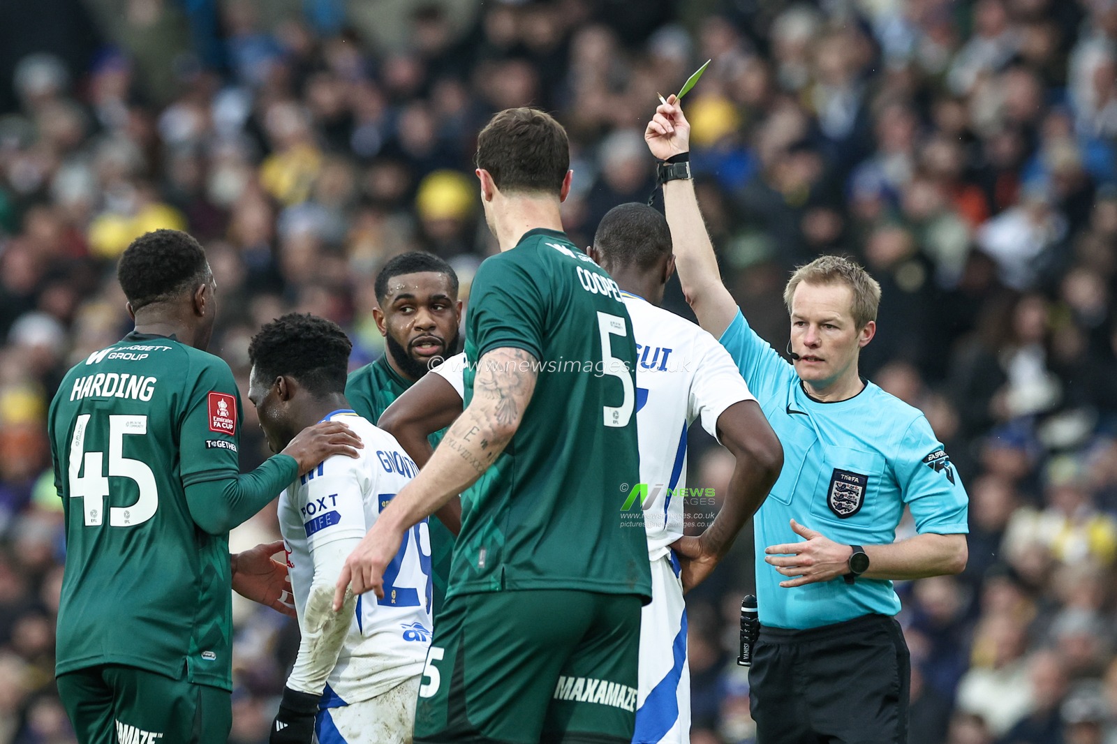 Referee Gavin Ward gives a yellow card to Josuha Guilavogui of Leeds United during the Emirates FA Cup Fourth Round match Leeds United vs Millwall at Elland Road, Leeds, United Kingdom, 8th February 2025

(Photo by Mark Cosgrove/News Images)