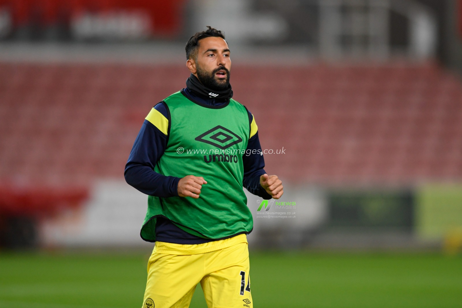 Saman Ghoddos #14 of Brentford warming up before the game