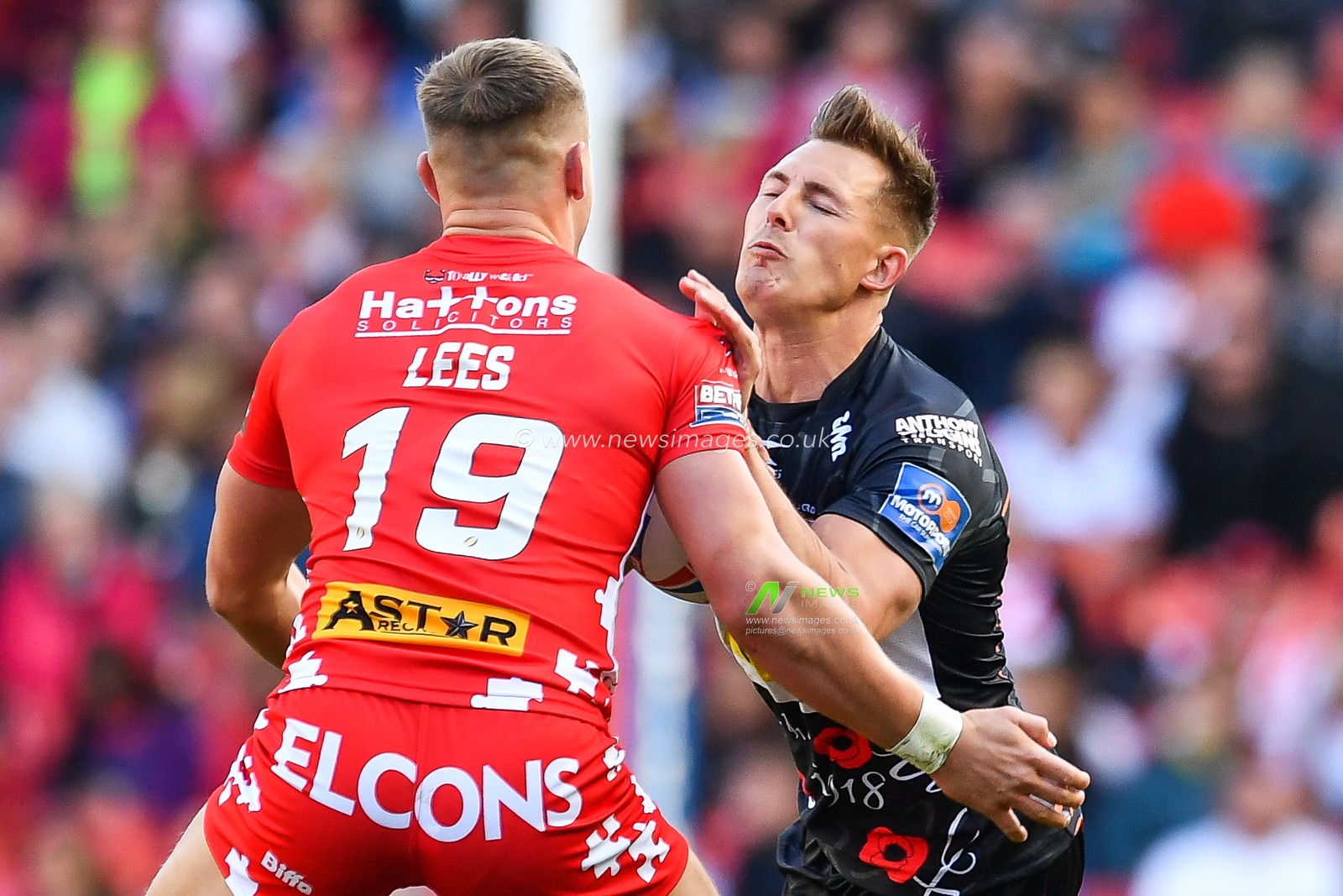26th May 2019 , Anfield Stadium, Liverpool, England; Dacia Magic Weekend, Betfred Super League Round 16, St Helens vs Castleford Tigers ; Greg Eden (5) of Castleford Tigers is tackled by Matty Lees (19) of St Helens 

Credit: Craig Thomas/News Images