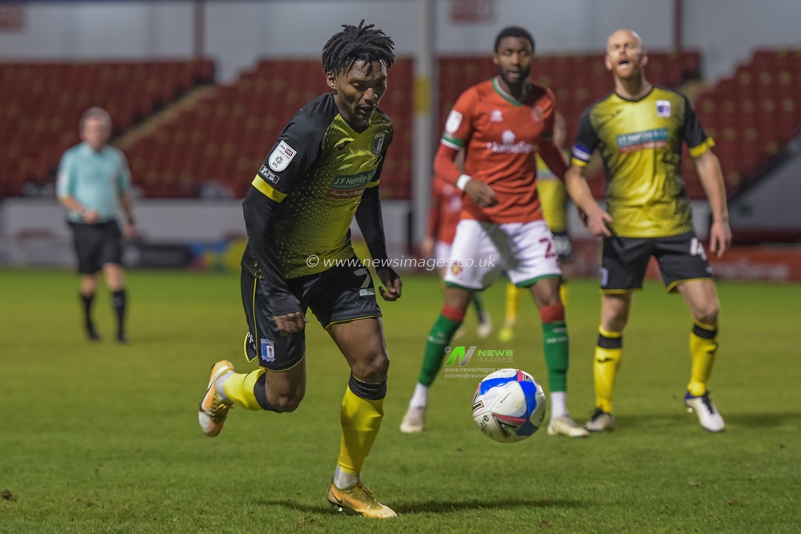 Kgosi Ntlhe #24 of Barrow claims the ball at the back for Barrow