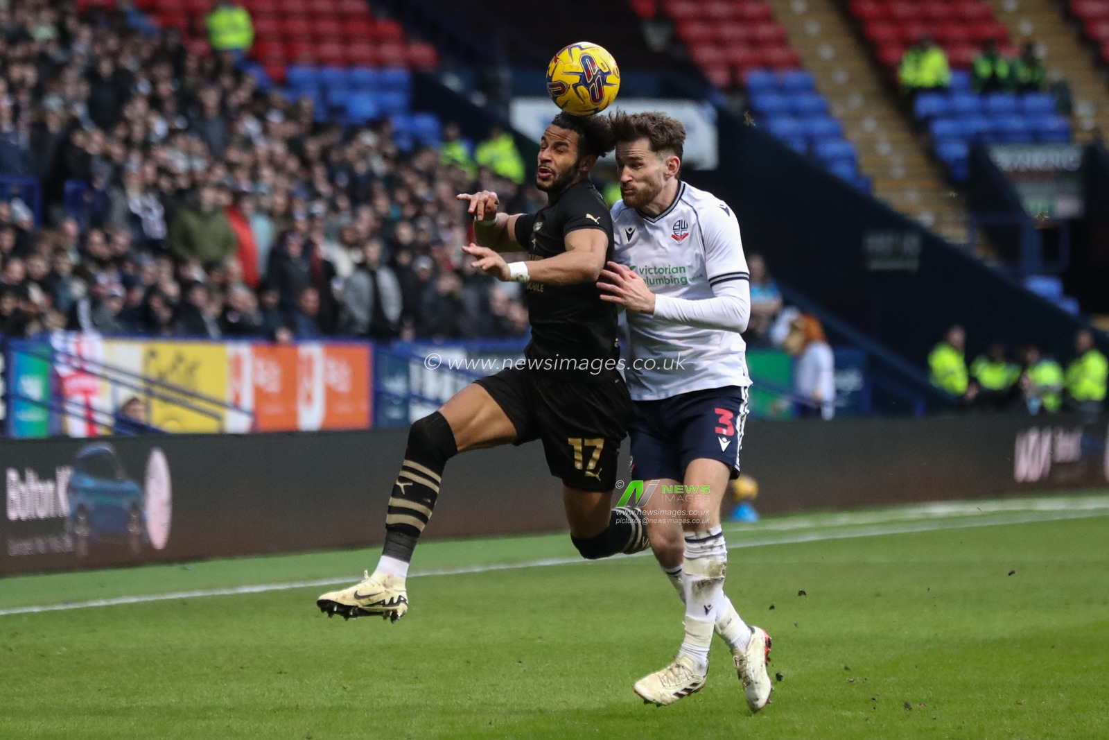 Barry Cotter of Barnsley jumps up to win the high ball from Jack Iredale of Bolton Wanderers during the Sky Bet League 1 match Bolton Wanderers vs Barnsley at Toughsheet Community Stadium, Bolton, United Kingdom, 3rd February 2024

(Photo by Alfie Cosgrove/News Images)