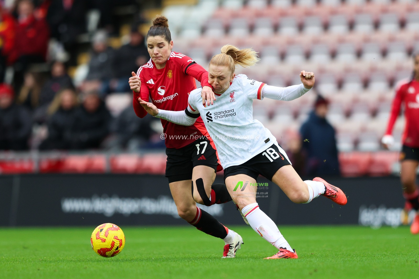 Ceri Holland of Liverpool is pressured by Dominique Janssen of Manchester Unitedduring the Barclays Women's Super League match Manchester United Women vs Liverpool Women at Leigh Sports Village, Leigh, United Kingdom, 8th December 2024

(Photo by Alex Roebuck/News Images)