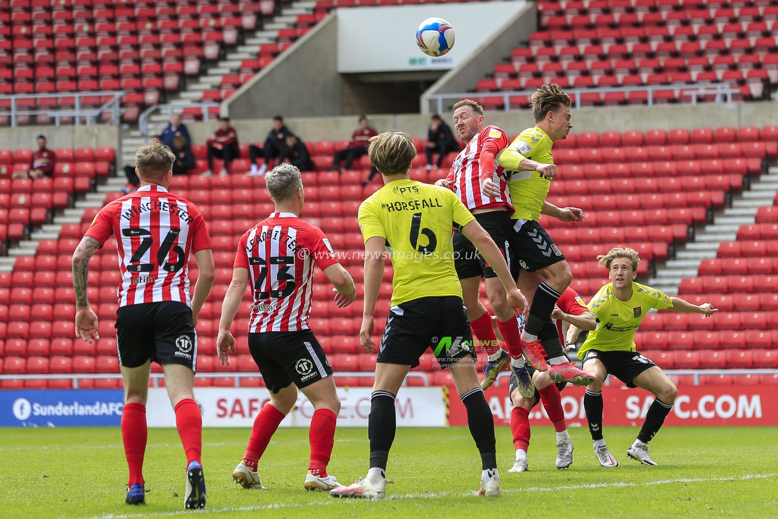 Aiden McGeady #28 of Sunderland in an aerial challenge with Ryan Watson #8 of Northampton Town