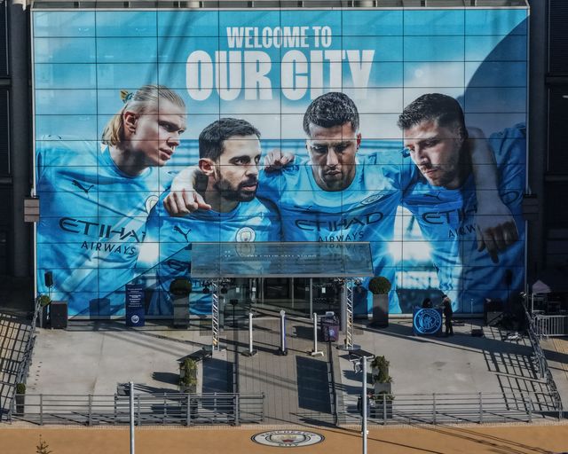 An aerial view of The Etihad Stadium and the players entrance with the Erling Haaland, Bernardo Silva, Rodrigo and Ruben Dias of Manchester City mural during the Premier League match Manchester City vs Nottingham Forest at Etihad Stadium, Manchester, United Kingdom on 04 March 2026

(Photo by Mark Cosgrove/News Images)