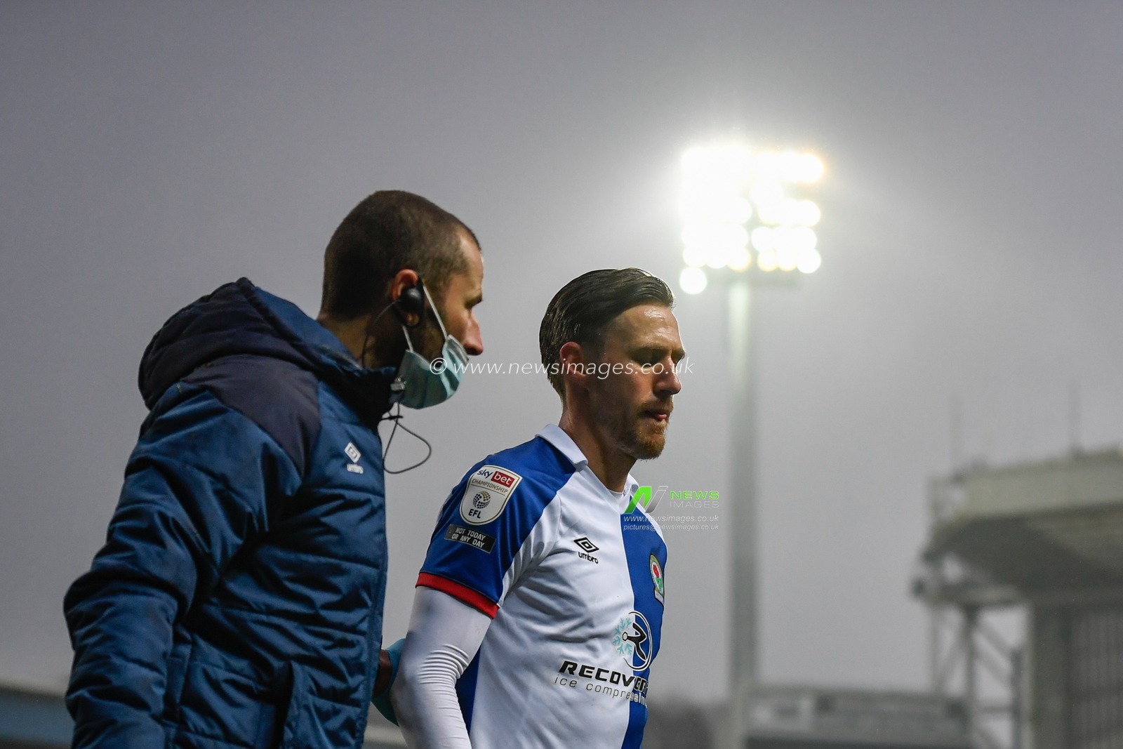 Barry Douglas #15 of Blackburn Rovers leaves the pitch after picking up an injury