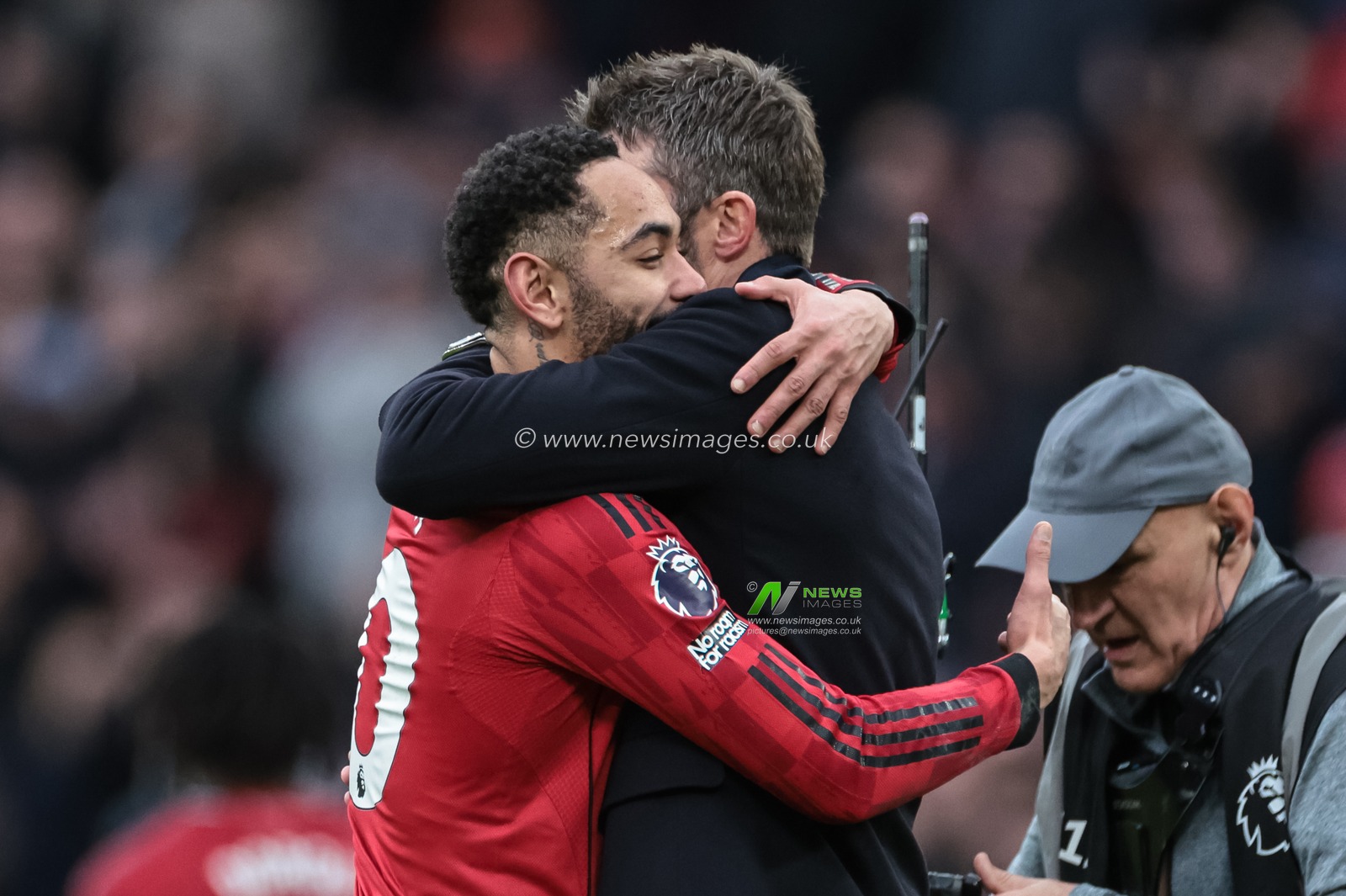 Michael Carrick interim head coach of Manchester United embraces Matheus Cunha of Manchester United as they celebrate the 2-0 win during the Premier League match Manchester United vs Manchester City at Old Trafford, Manchester, United Kingdom, 17th January 2026

(Photo by Mark Cosgrove/News Images)