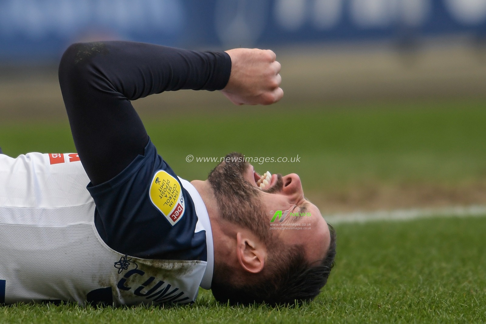 Greg Cunningham #37 of Preston North End on the ground after picking up an injury
