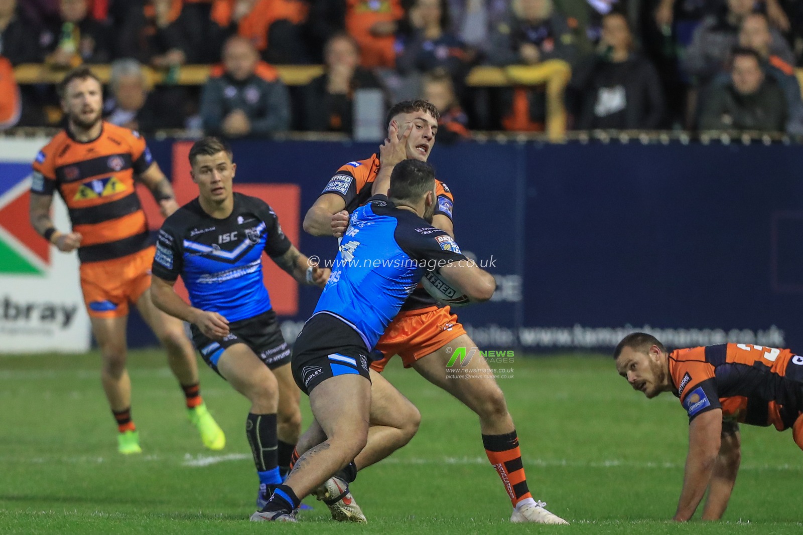 5th September 2019 , Mend-A-Hose Jungle, England; Betfred Super League, Round 28, Castleford Tigers vs Hull FC ; Jake Trueman (6) of Castleford Tigers is tackled by Jake Connor (14) of Hull FC 


Credit: Mark Cosgrove/News Images