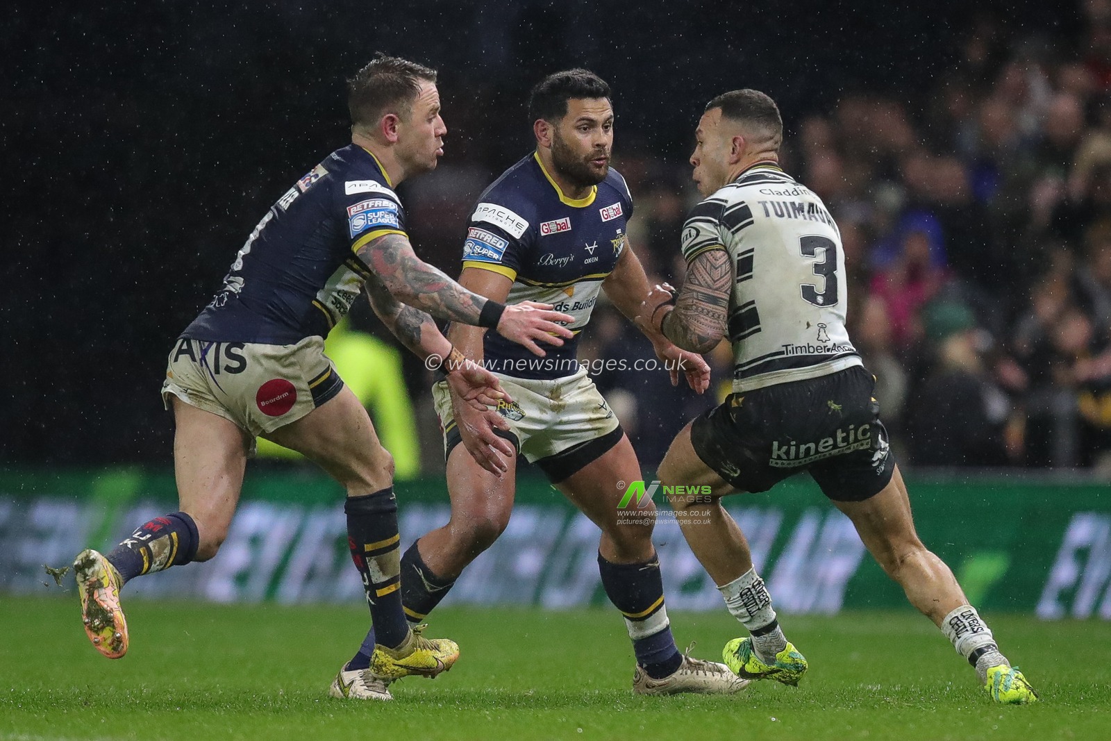 Carlos Tuimavave #3 of Hull FC is tackled by Rhyse Martin #12 of Leeds Rhinos and Richie Myler #1 of Leeds Rhinos during the Betfred Super League Round 9 match Leeds Rhinos vs Hull FC at Headingley Stadium, Leeds, United Kingdom, 14th April 2023

(Photo by James Heaton/News Images)