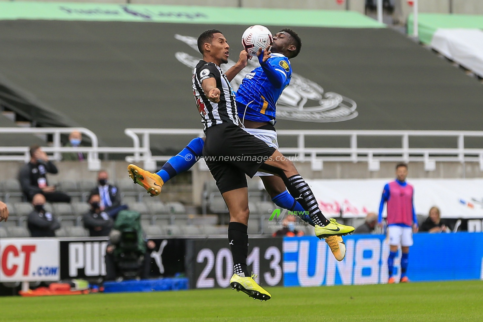 Isaac Hayden (14) of Newcastle United in an aerial challenge Yves Bissouma (8) of Brighton and Hove Albion