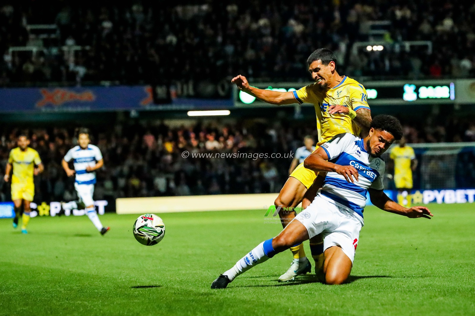 Daniel Munoz of Crystal Palace is tackled by Jonathan Varane of Queens Park Rangers during the Carabao Cup match Queens Park Rangers vs Crystal Palace at Kiyan Prince Foundation Stadium, London, United Kingdom, 17th September 2024

(Photo by Izzy Poles/News Images)