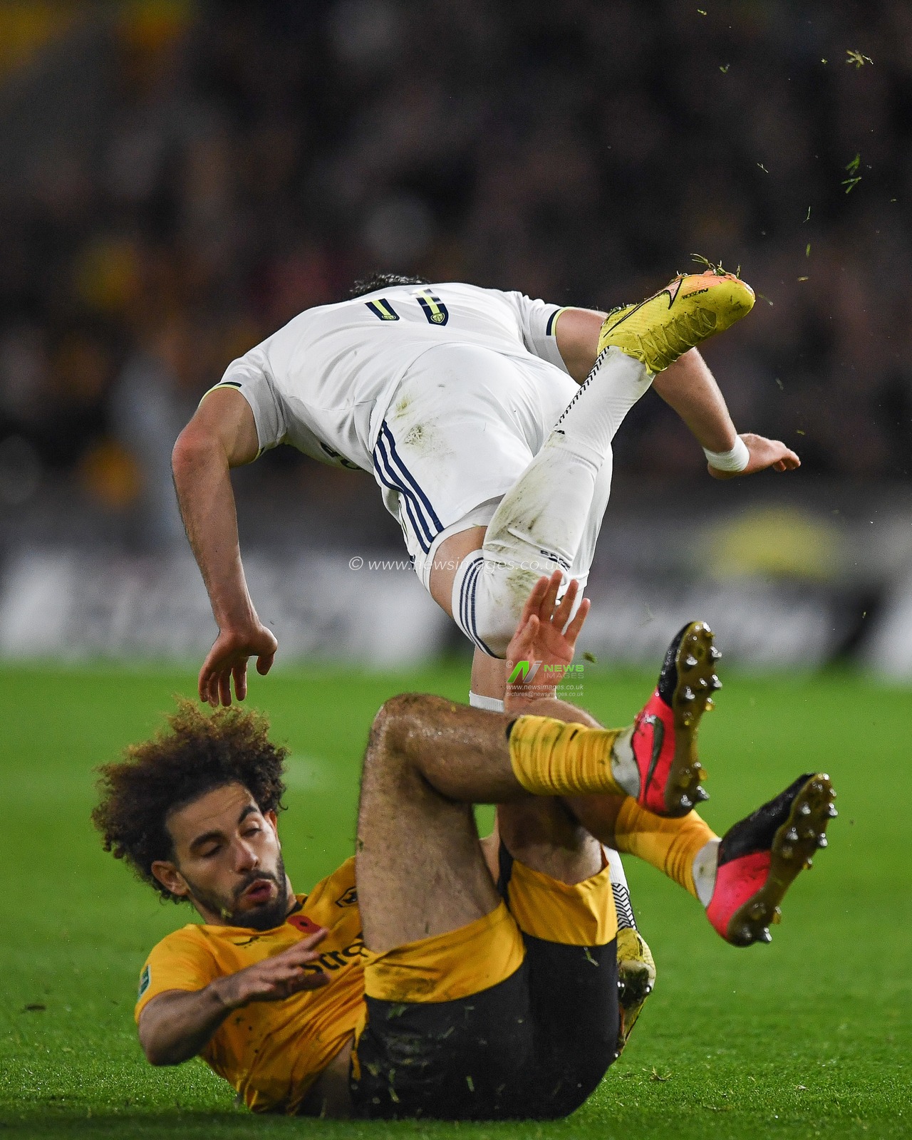 Rayan AÃ¯t-Nouri #3 of Wolverhampton Wanderers tackles Jack Harrison #11 of Leeds United during the Carabao Cup match Wolverhampton Wanderers vs Leeds United at Molineux, Wolverhampton, United Kingdom, 9th November 2022

(Photo by Mike Jones/News Images)