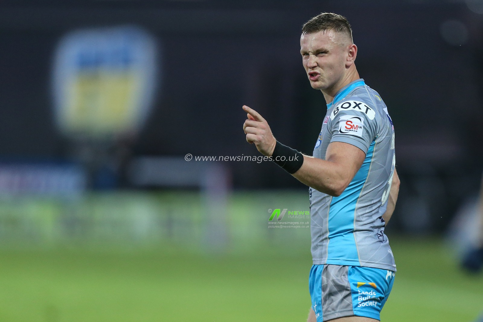 Harry Newman #3 of Leeds Rhinos gestures to his team mate