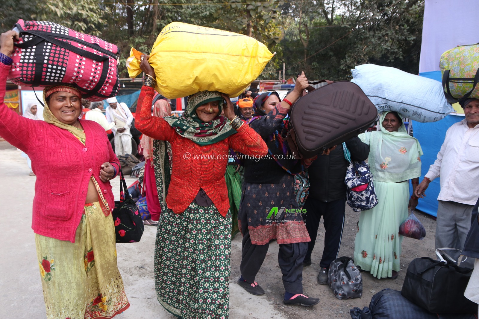 Pilgrims arrive at a transit camp on the way to Gangasagar in Kolkata, India, on Thursday, January 9, 2025.Thousands of Hindu pilgrims are expected to take the annual holy dip at Gangasagar, where the Ganges River meets the Bay of Bengal, on the auspicious Makar Sankranti festival day on January 14.Pictures by Debajyoti Chakraborty.(Photo: Debajyoti Chakraborty/News Images)