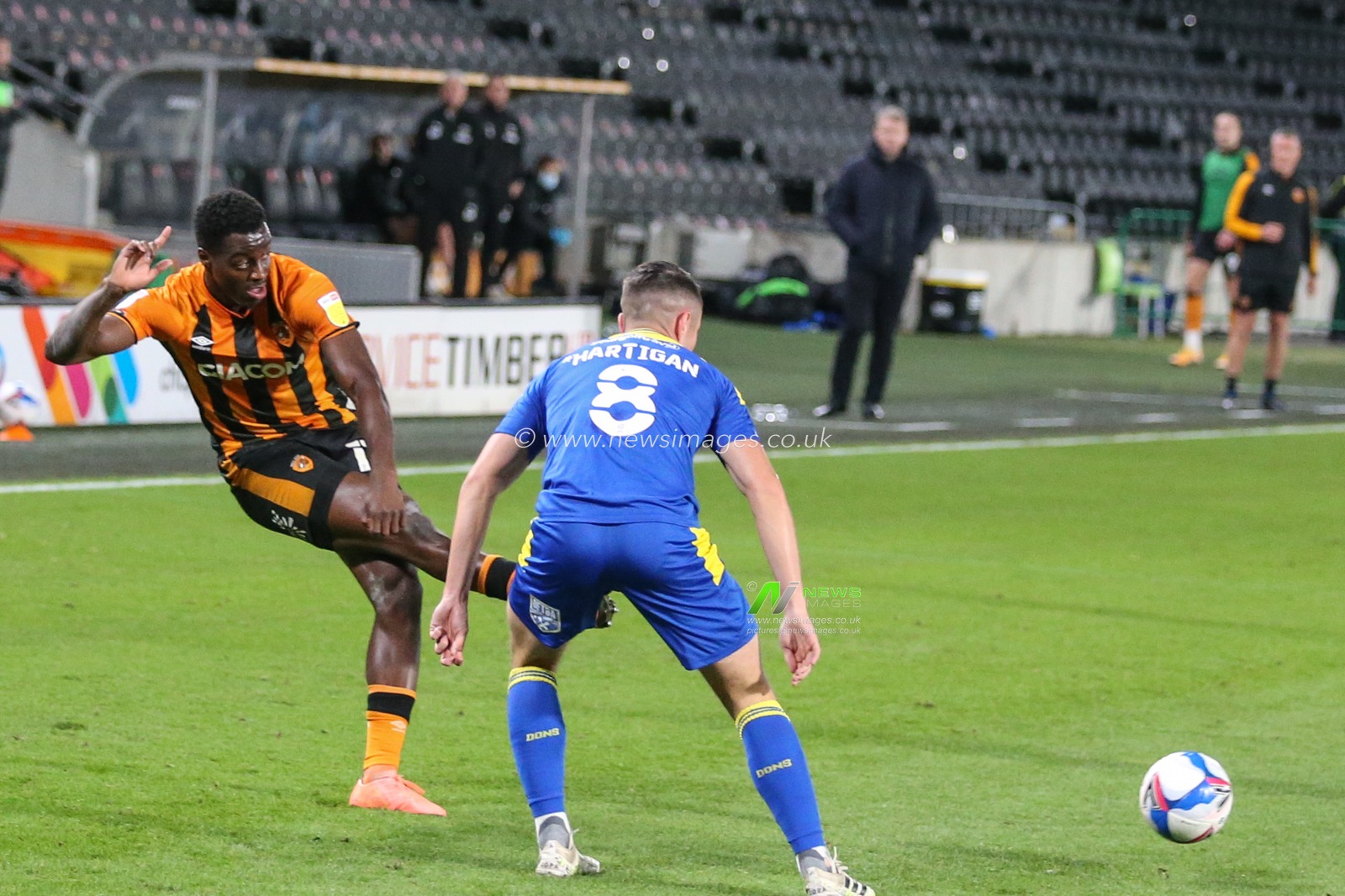 Joshua Emmanuel (12) of Hull City looks to go past Anthony Hartigan (8) of AFC Wimbledon
