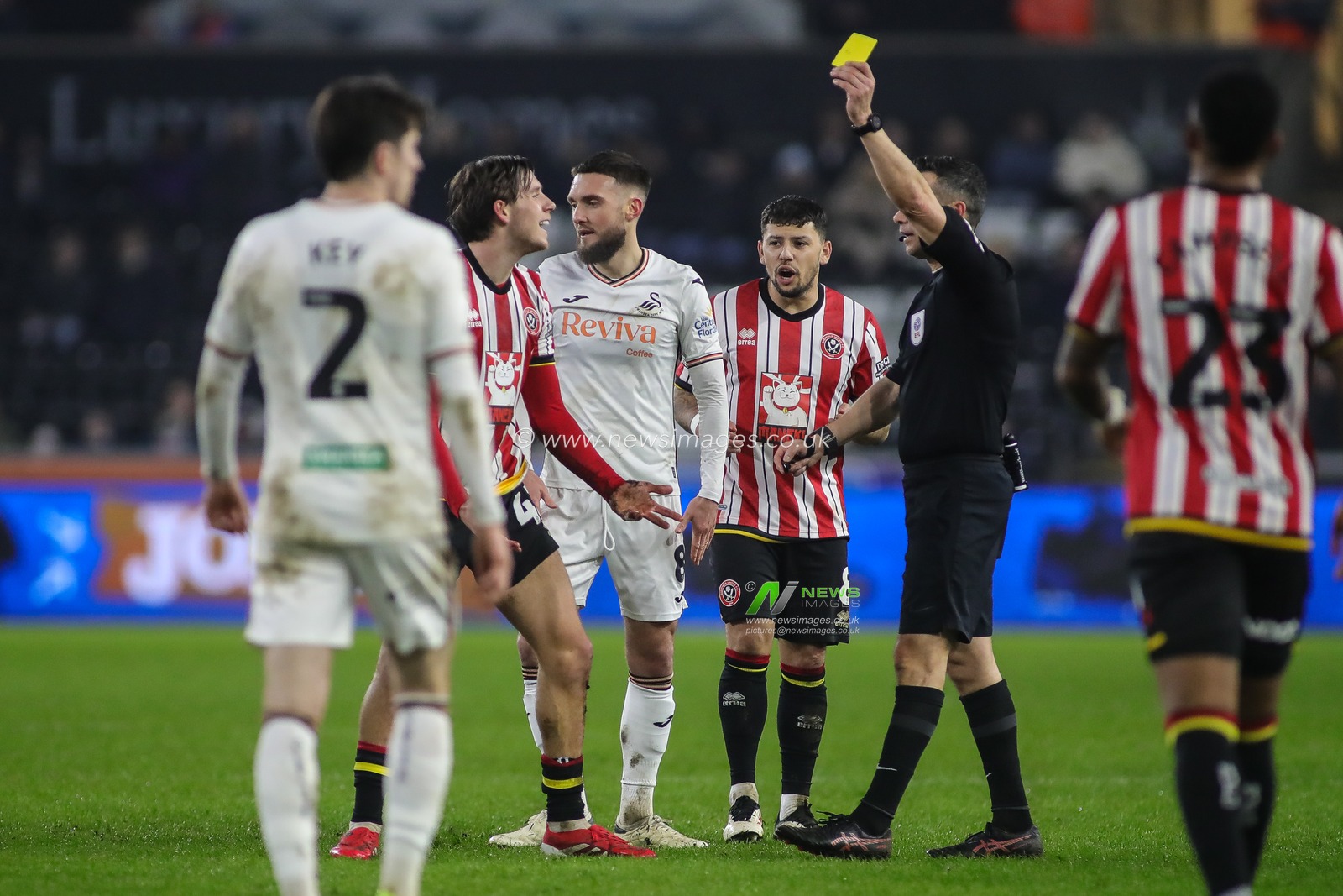 Sydie Peck of Sheffield United receives a yellow card from Referee Dean Whitestone during the Sky Bet Championship match Swansea City vs Sheffield United at Swansea.com Stadium, Swansea, United Kingdom, 21st January 2025

(Photo by Andrew Lewis/News Images)