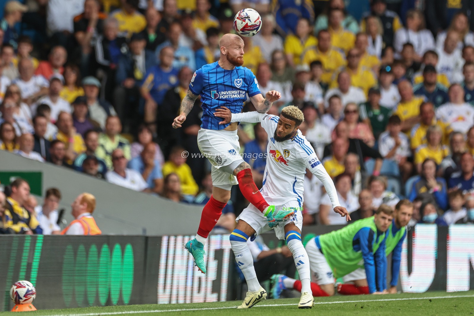 Connor Ogilvie of Portsmouth fouled by Jayden Bogle of Leeds United during the Sky Bet Championship match Leeds United vs Portsmouth at Elland Road, Leeds, United Kingdom, 10th August 2024

(Photo by Mark Cosgrove/News Images)