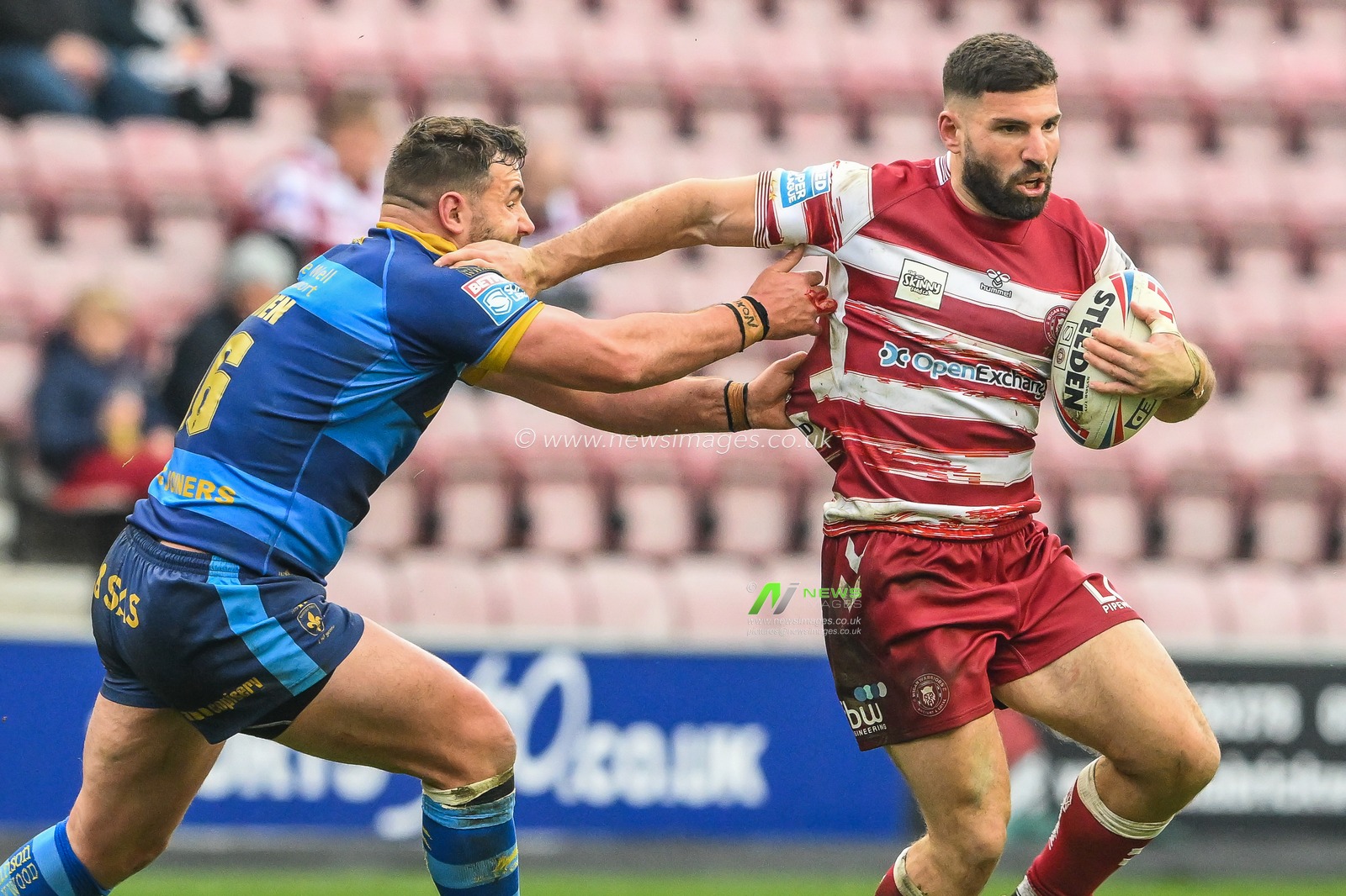 Abbas Miski #23 of Wigan Warriors breaks the tackle of Josh Bowden #16 of Wakefield Trinity during the Betfred Super League Round 10 match Wigan Warriors vs Wakefield Trinity at DW Stadium, Wigan, United Kingdom, 23rd April 2023

(Photo by Craig Thomas/News Images)