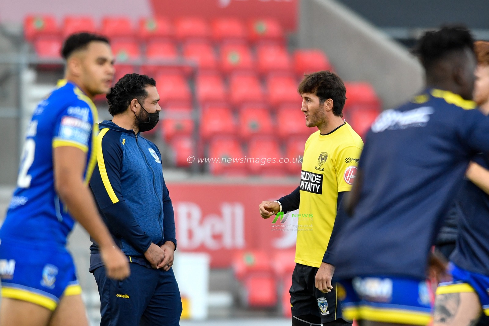Stefan Ratchford (1) and Ben Murdoch-Masila (13) of Warrington Wolves take on different roles tonight and assist with the warm ups
