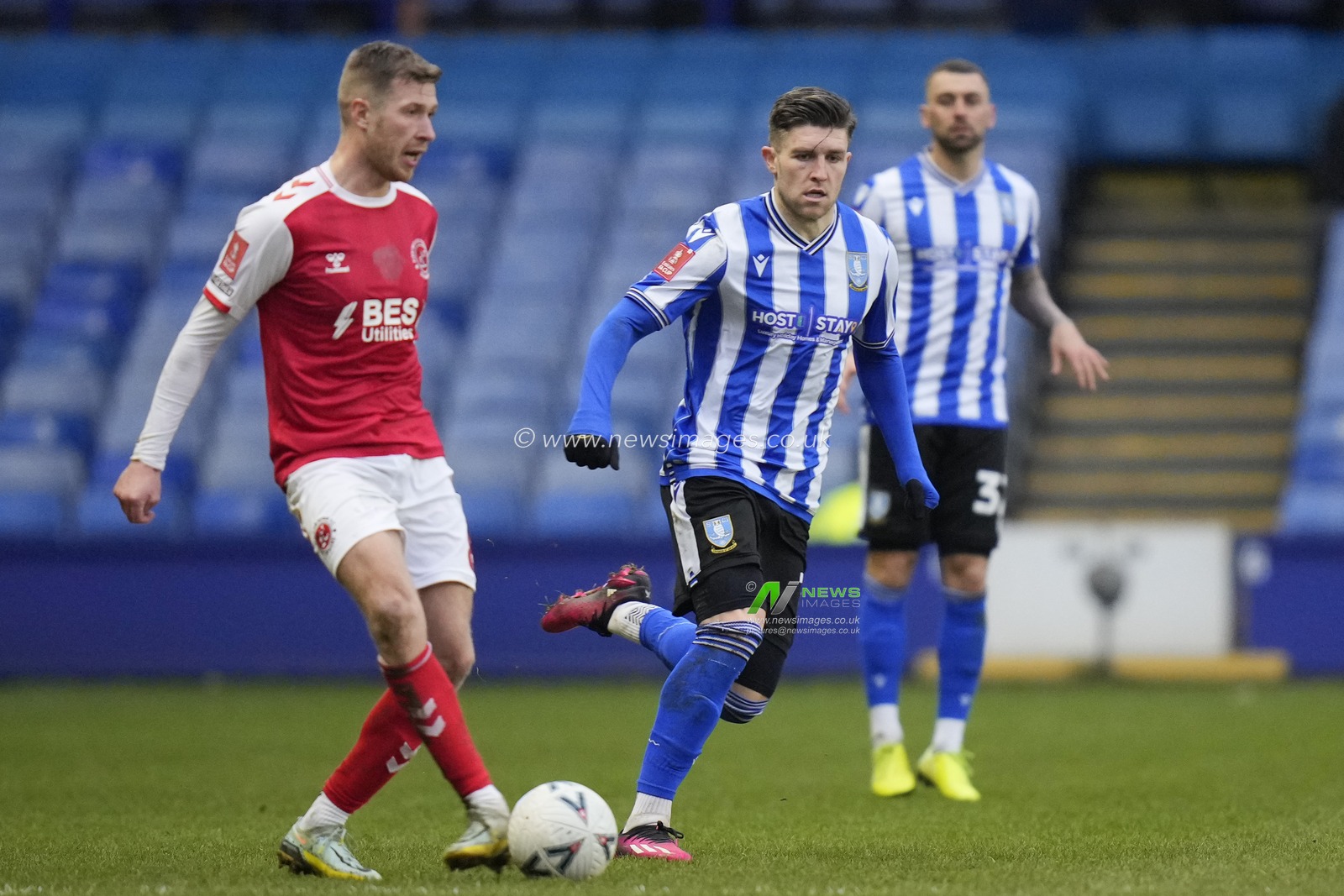 Josh Vela #8 of Fleetwood Town passes under pressure from Josh Windass #11 of Sheffield Wednesday during the Emirates FA Cup Fourth Round match Sheffield Wednesday vs Fleetwood Town at Hillsborough, Sheffield, United Kingdom, 28th January 2023

(Photo by Steve Flynn/News Images)