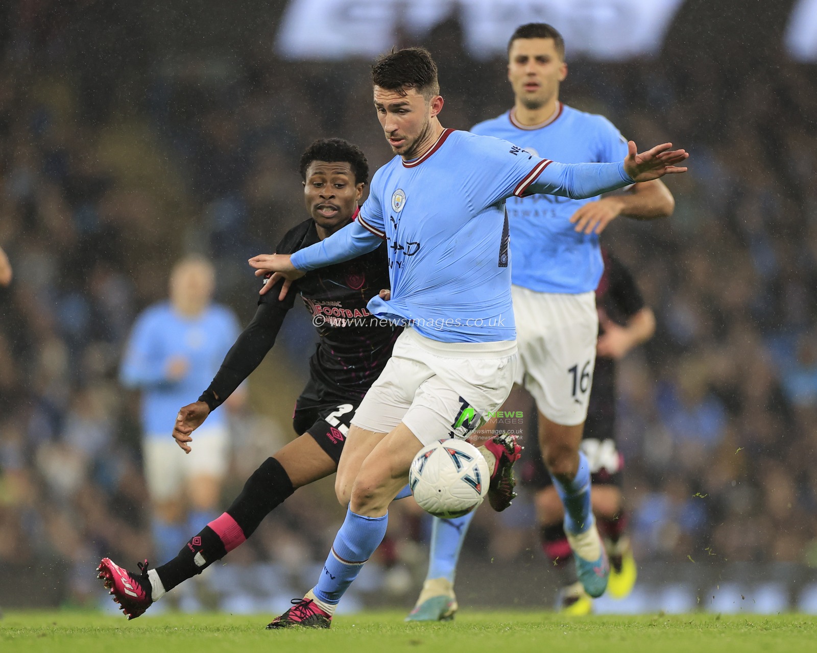 Aymeric Laporte #14 of Manchester City  shields the ball from Nathan Tella #23 of Burnley during the Emirates FA Cup Quarter Final match Manchester City vs Burnley at Etihad Stadium, Manchester, United Kingdom, 18th March 2023

(Photo by Conor Molloy/News Images)