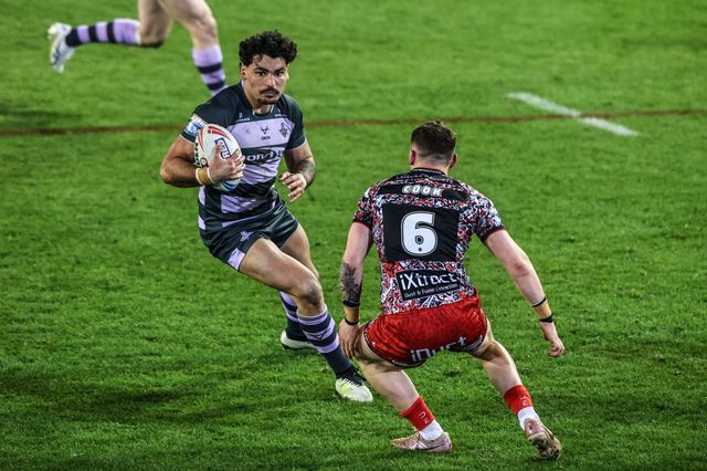 Mathieu Cozza of Huddersfield Giants is tackled by Adam Cook of Leigh Leopards during the Betfred Super League round 9 match Leigh Leopards vs Huddersfield Giants at Leigh Sports Village, Leigh, United Kingdom on 23 April 2026

(Photo by Alfie Cosgrove/News Images)