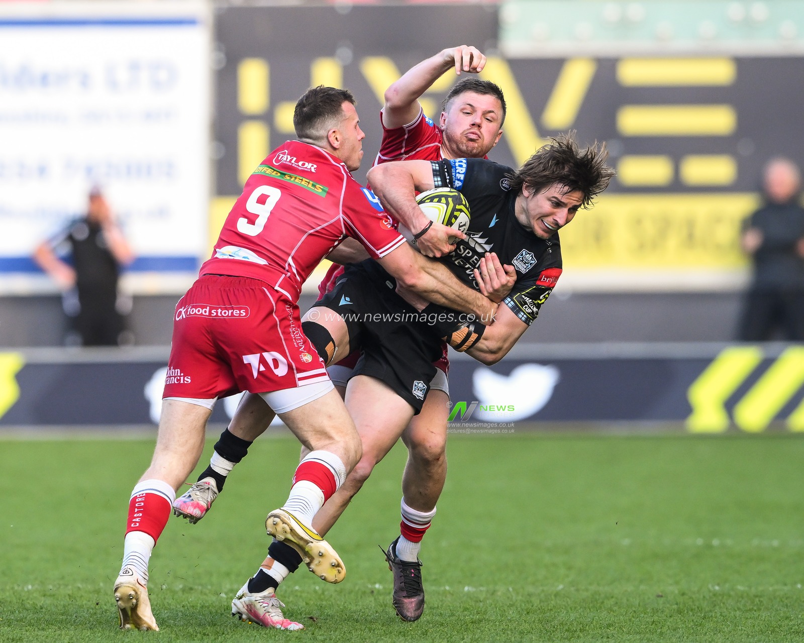 Ebastian Cancelliere of Glasgow Warriors is tackled by Steff Evans and Gareth Davies of Scarlets during the European Challenge Cup Semi-Final match Llanelli Scarlets vs Glasgow Warriors at Parc y Scarlets, Llanelli, United Kingdom, 29th April 2023

(Photo by Craig Thomas/News Images)