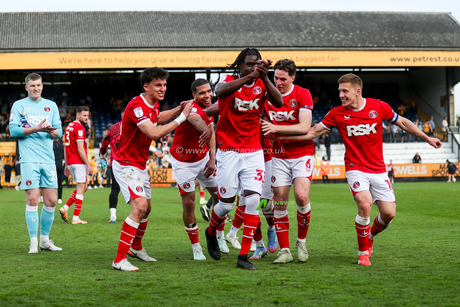 Micah Mbick of Charlton Athletic and teammates celebrate with the fans after the teams victory following the Sky Bet League 1 match Cambridge United vs Charlton Athletic at Cledara Abbey Stadium, Cambridge, United Kingdom, 12th April 2025

(Photo by Izzy Poles/News Images)