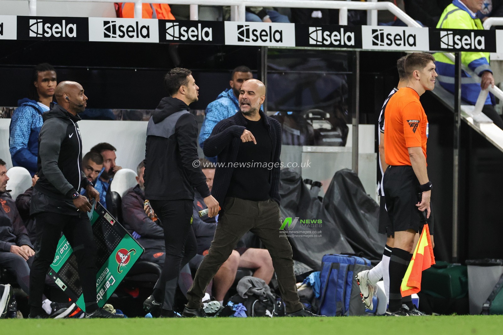 Pep Guardiola manager of Manchester City reacts with a fourth official during the Carabao Cup Third Round match Newcastle United vs Manchester City at St. James's Park, Newcastle, United Kingdom, 27th September 2023

(Photo by Mark Cosgrove/News Images)