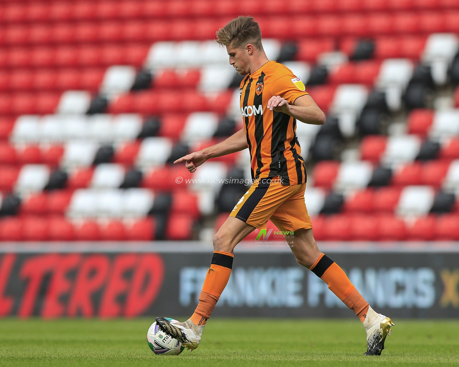Reece Burke (5) of Hull City in action