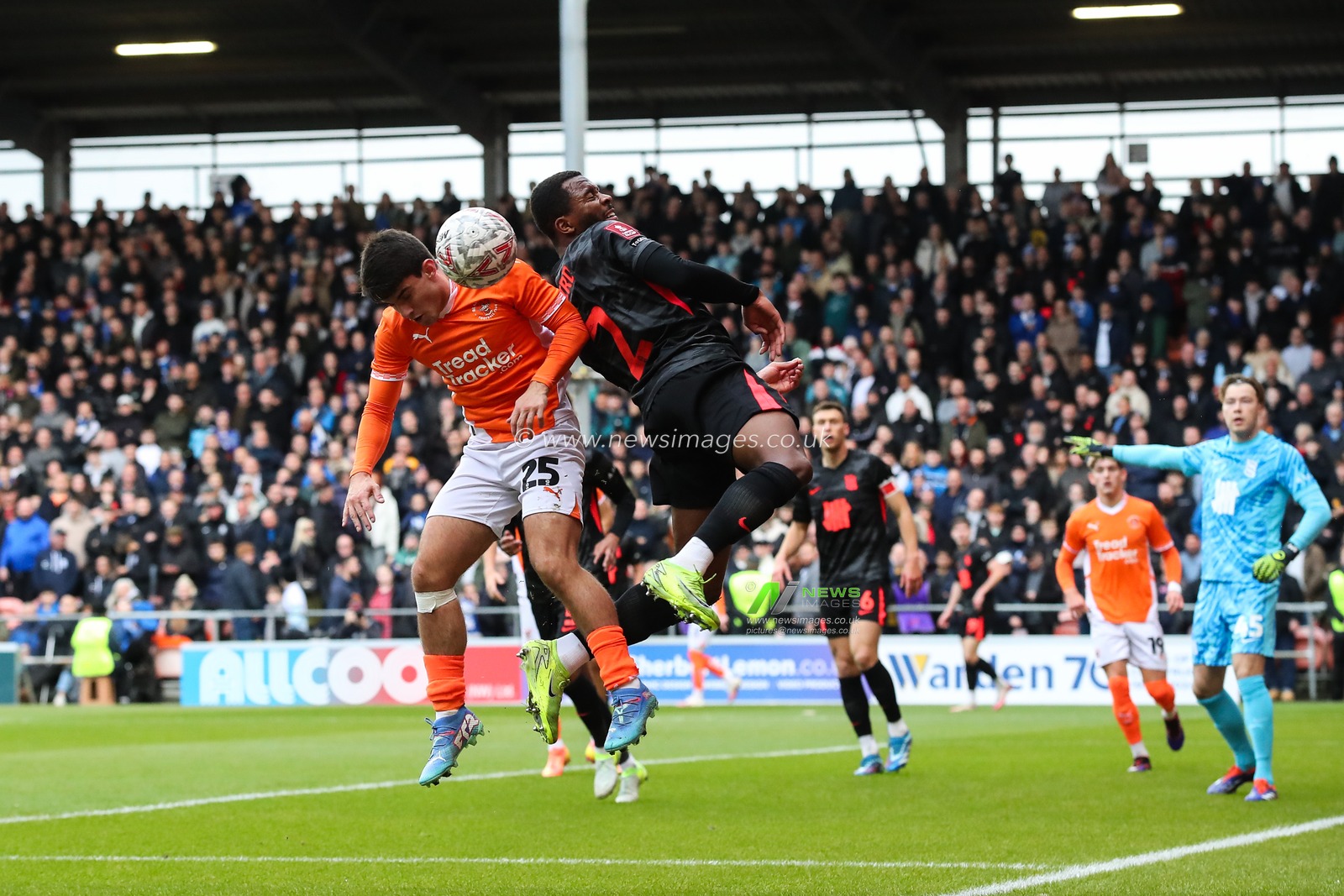 Rob Apter of Blackpool and Ethan Laird of Birmingham City battle for the ball during the Emirates FA Cup 2nd Round match Blackpool vs Birmingham City at Bloomfield Road, Blackpool, United Kingdom, 1st December 2024

(Photo by Gareth Evans/News Images)