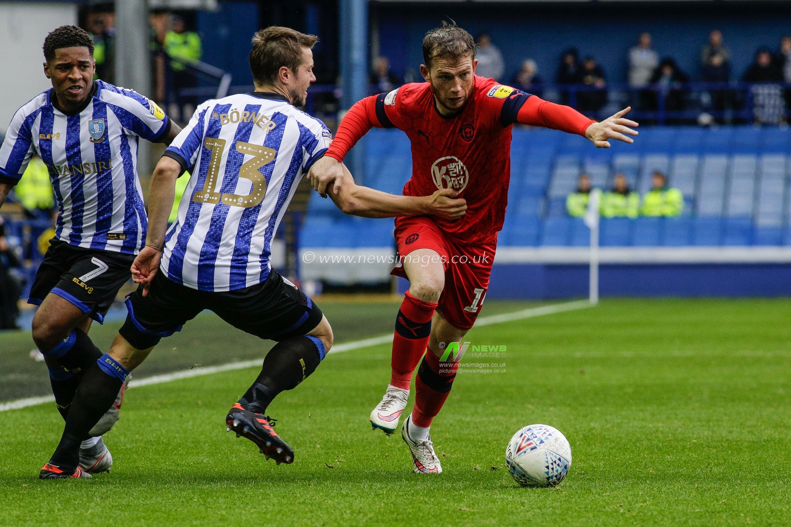 5th October 2019, Hillsborough, Sheffield, England; Sky Bet Championship, Sheffield Wednesday v Wigan Athletic : Julian Borner (13) of Sheffield Wednesday pulls Charlie Mulgrew over 

Credit: Kurt Fairhurst/News Images